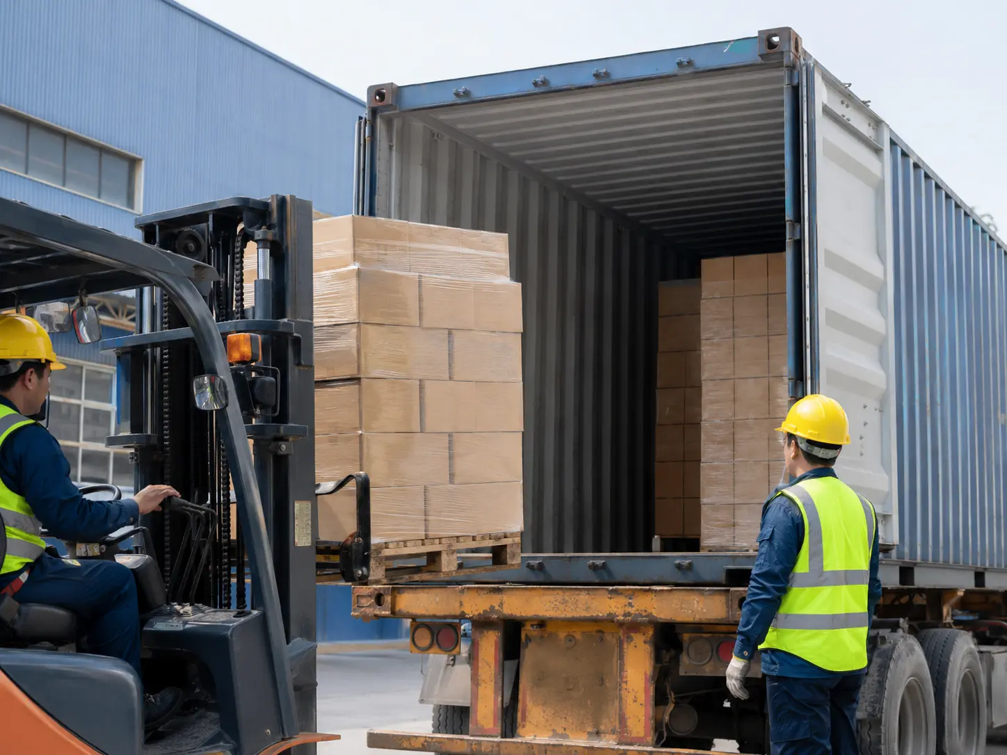 Safety footwear cartons being loaded into an export shipping container